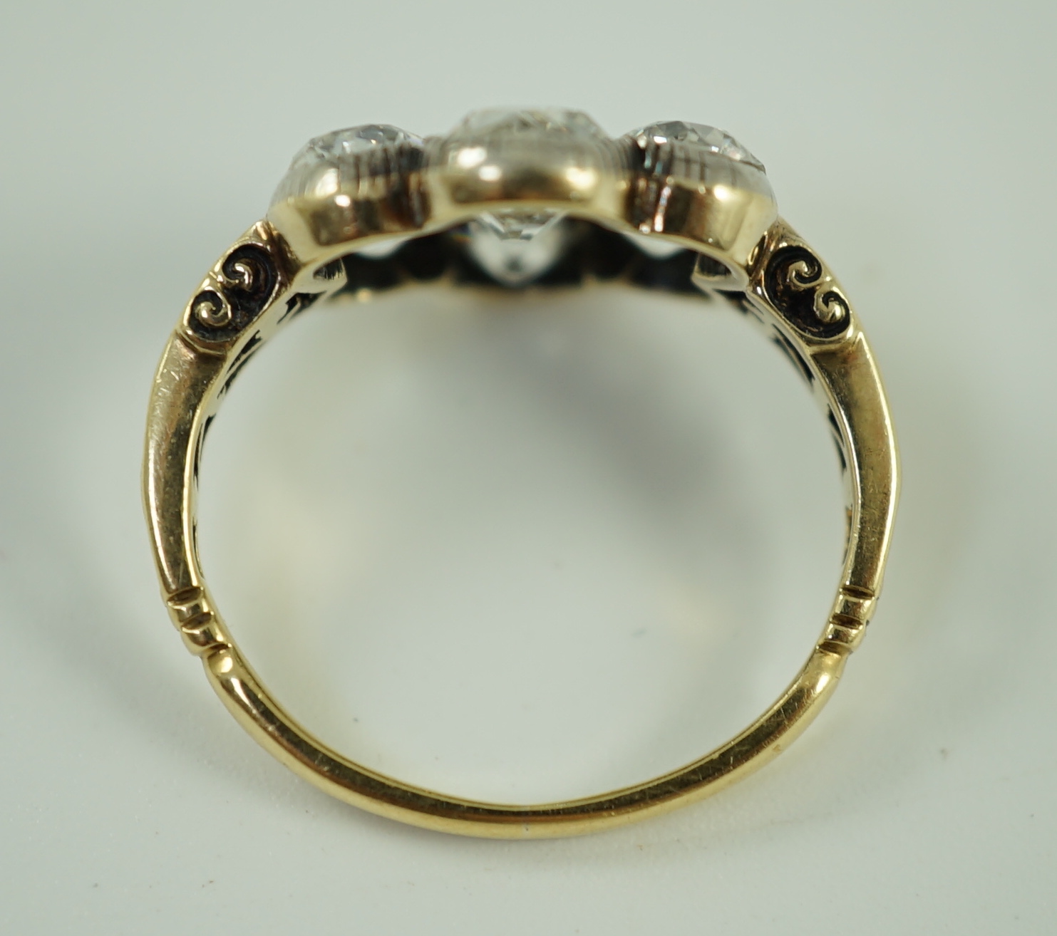 A late 19th/early 20th century gold and collet set seven stone old round cut diamond flower head cluster ring